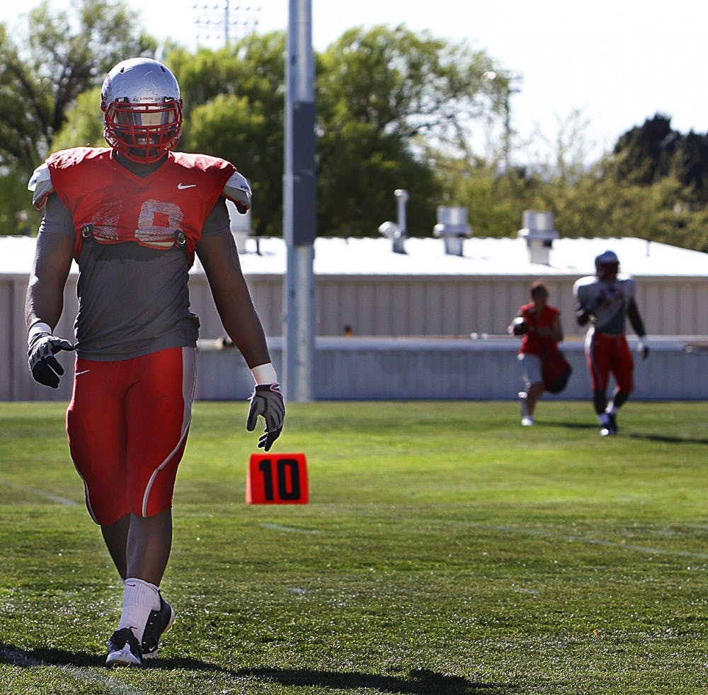 	Jaymar Latchison strolls down the sideline during practice on Wednesday at University Stadium. Latchison said he and other members of the team were ridiculed by classmates for going 1-11 last season.