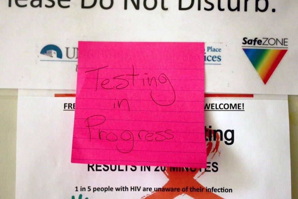 A note is posted on a door at the LGBTQ Resource Center indicated that a Sexually Transmitted Disease test is taking place.