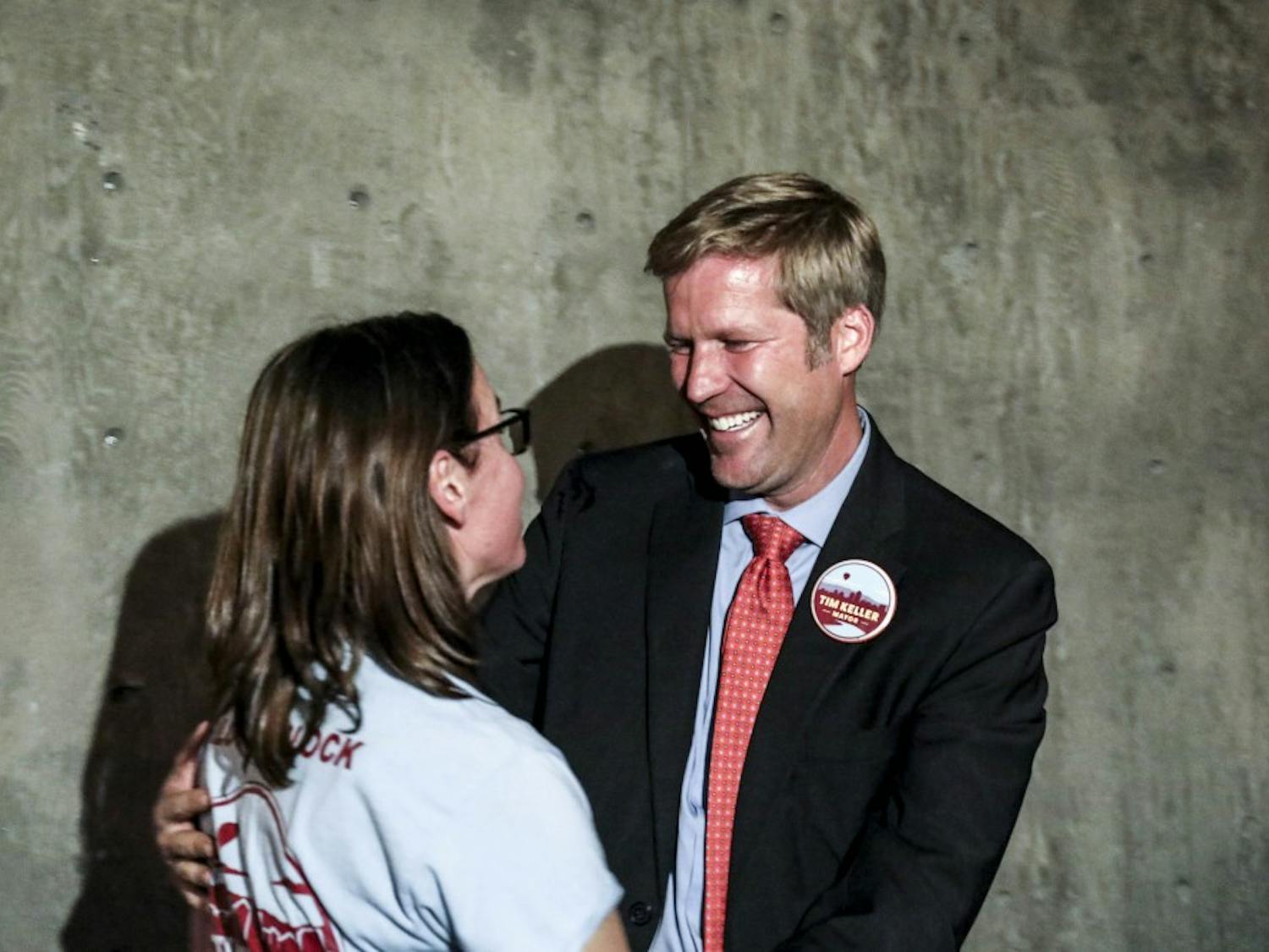 Timothy ?Tim? Keller embraces his wife Elizabeth Kistin Keller during his mayoral election watch party on Oct. 3, 2017 at Red Door Brewing Company. 


