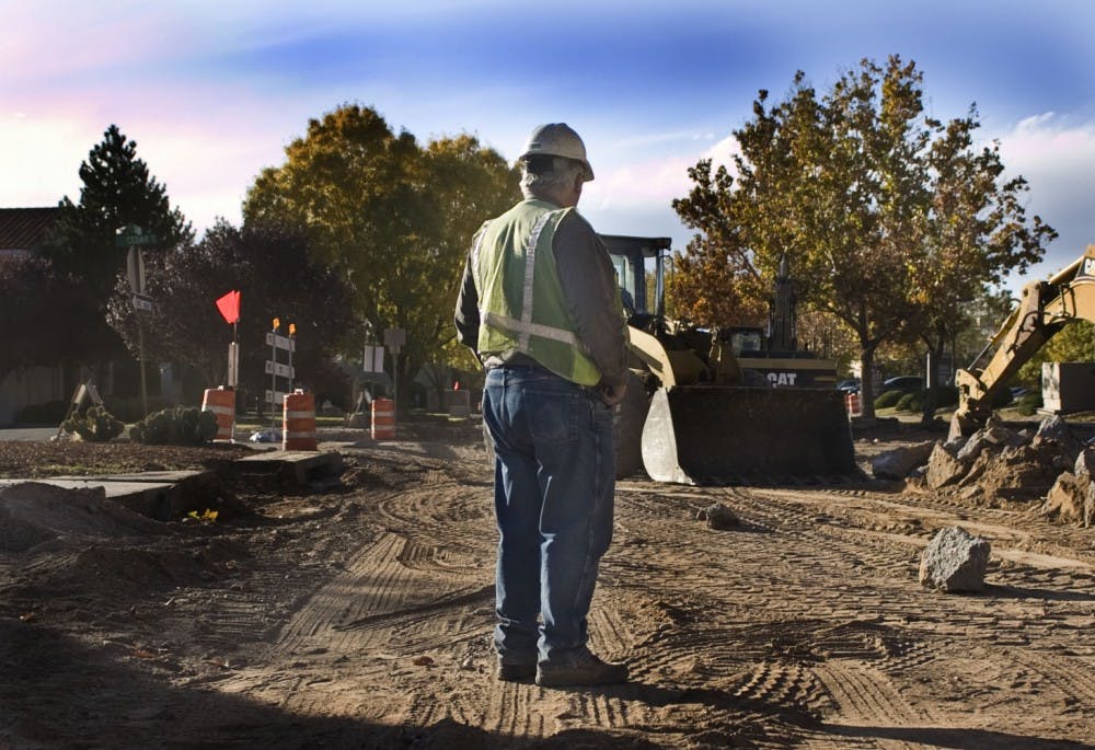 	Guzman Construction project manager Tom Kryfko overlooks the removal of sidewalk and curb along Lead Avenue on Thursday. Construction on the one-way avenue, from Oak street and Washington street, is expected to be completed in eight months.