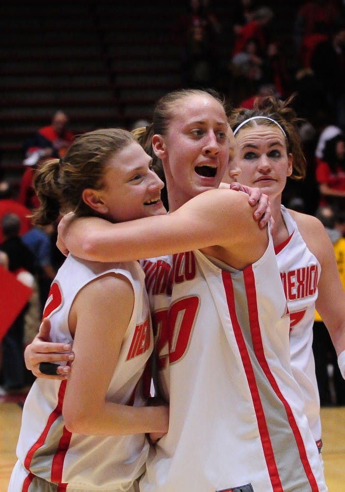 	Sara Halasz and Amy Beggin embrace after the Lobos defeated Colorado State 65-50 inside The Pit on Wednesday. Beggin had a team-high 16 points in her first game back since sustaining a head injury against UNLV.