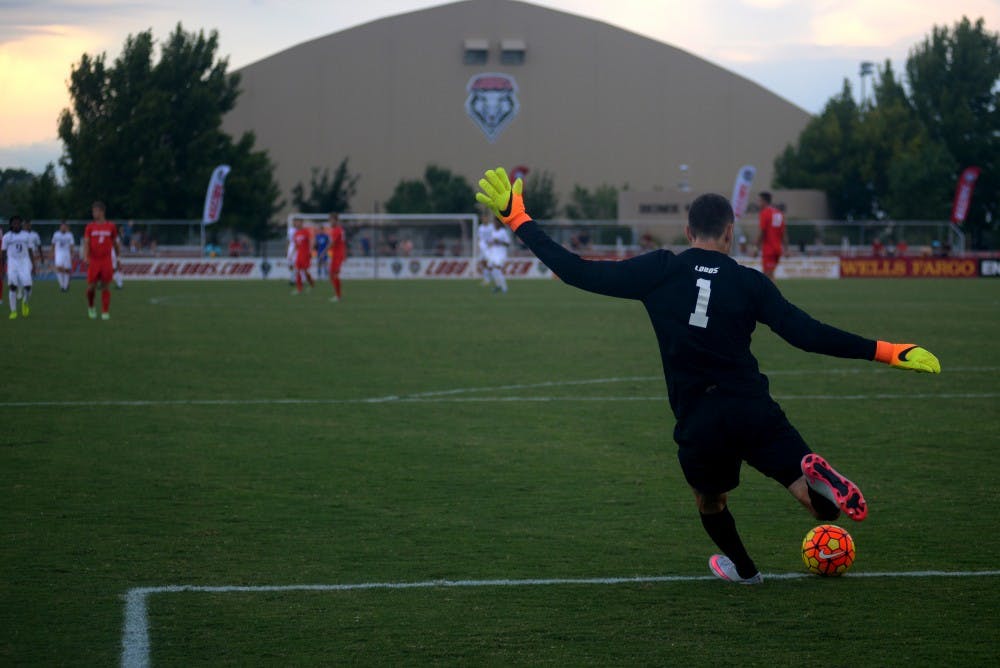 UNM goalkeeper Jason Beaulieu kicks the ball towards a teammate on Saturday evening at the UNM soccer stadium. The Lobos beat the Washington Huskies 1-0 to close out exhibition play.