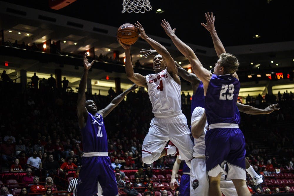 Redshirt junior guard Elijah Brown hurdles his way through Abilene Christian University players Wednesday, Nov. 30, 2016 at WisePies Arena. The Lobos defeated the Wildcats 64-55.&nbsp;