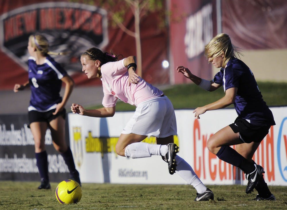 	Rachel Fields, center, speeds toward the ball on Saturday at the UNM Soccer Complex. The Lobos improved to 9-1-2 with the win over conference foe TCU.