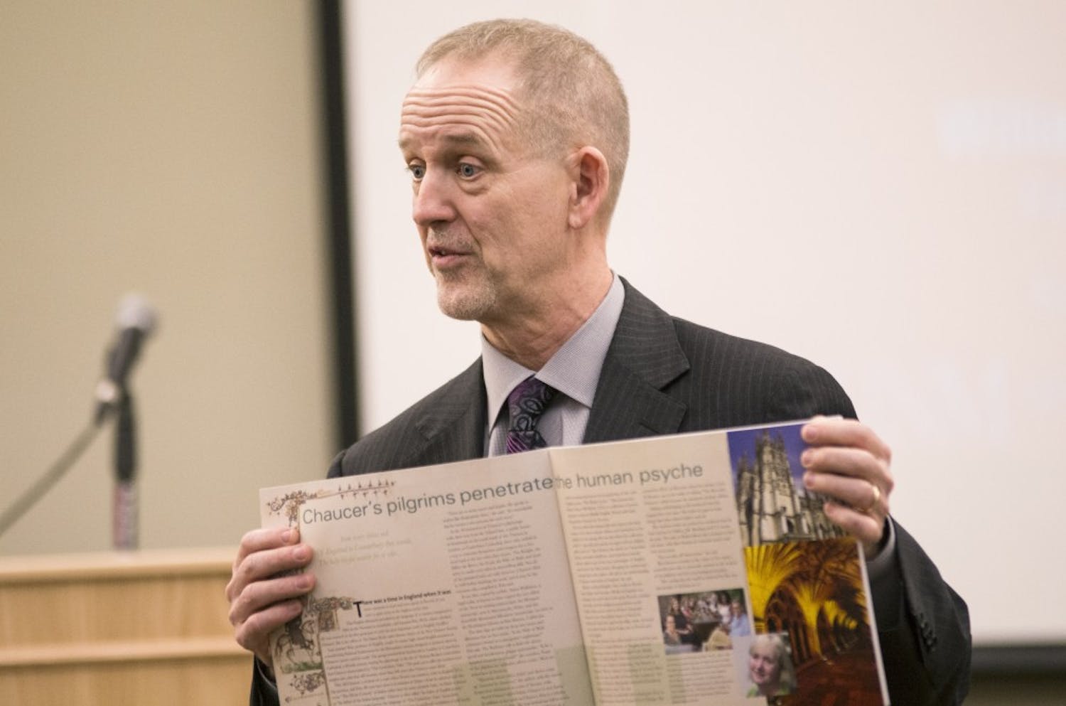 During a forum Tuesday at the SUB, Grant McGimpsey holds up a Kent State based research article that he helped oversee. McGimpsey is one of four candidates running for the vice president of research position at UNM. 