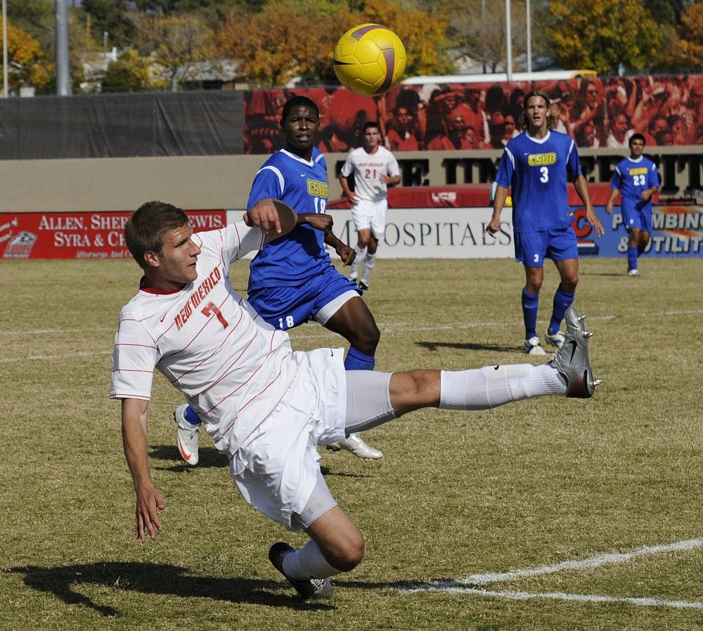 	Forward Justin Davis slides to the ground as the ball sails over him. The Lobos defeated Cal State Bakersfield 2-1 on Sunday at the UNM Soccer Complex.