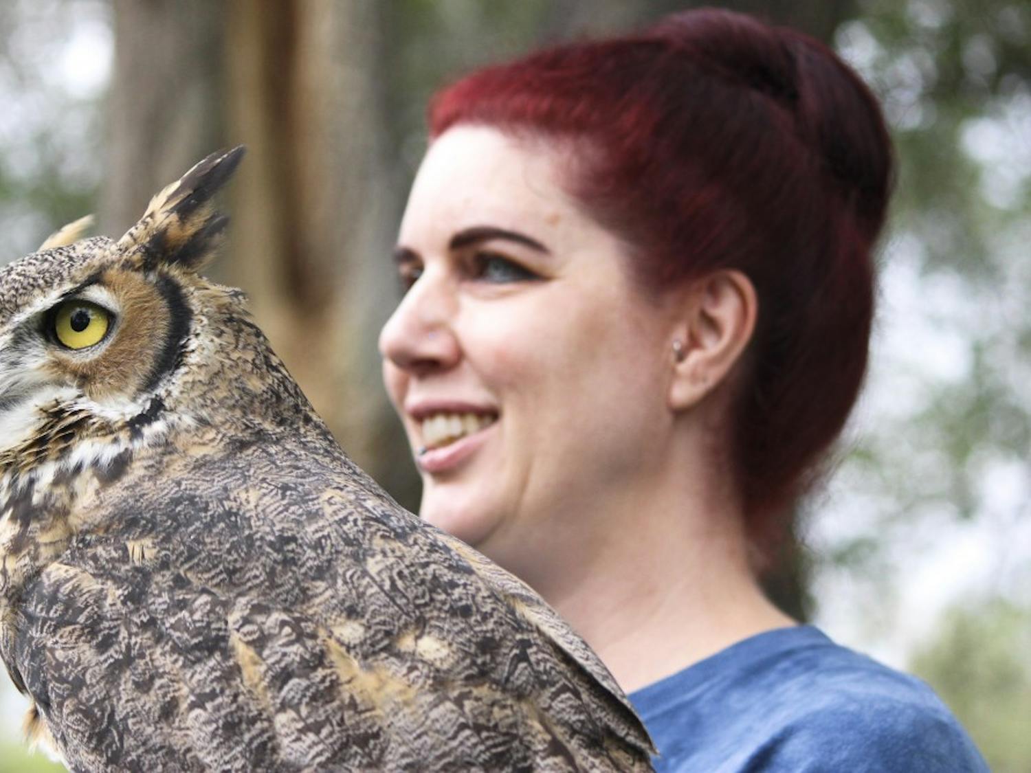 Tracy Birtel holds a Grey Horned Owl at Sunday’s event. Birtel and her colleagues are part of Wildlife Rescue of New Mexico, which helps rescue and rehabilitate injured animals before returning them to the wild.