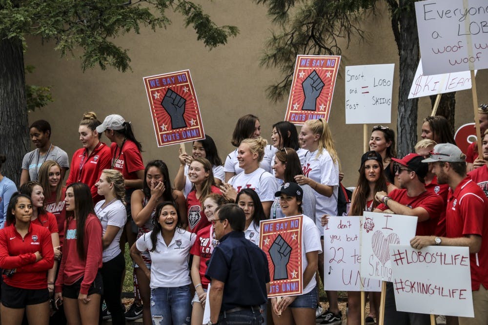 Members from UNM Beach Volleyball, UNM Ski and other UNM sports teams gathered to protest the recent cuts to the UNM sports department on Aug. 16, 2018 outside of Popejoy Hall.&nbsp;