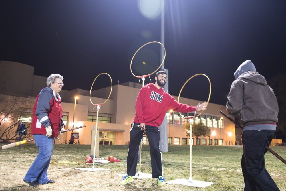 Shirley Johnson (left) and Seth Kazmar (right), head coaches of the Ridgebacks quidditch team, attempt to score against Vince DiBernardo (center) in a practice match Thursday at Johnson Field. Quidditch is the sport from the world of Harry Potter, and the Ridgebacks are still hosting tryouts for tournaments next year.