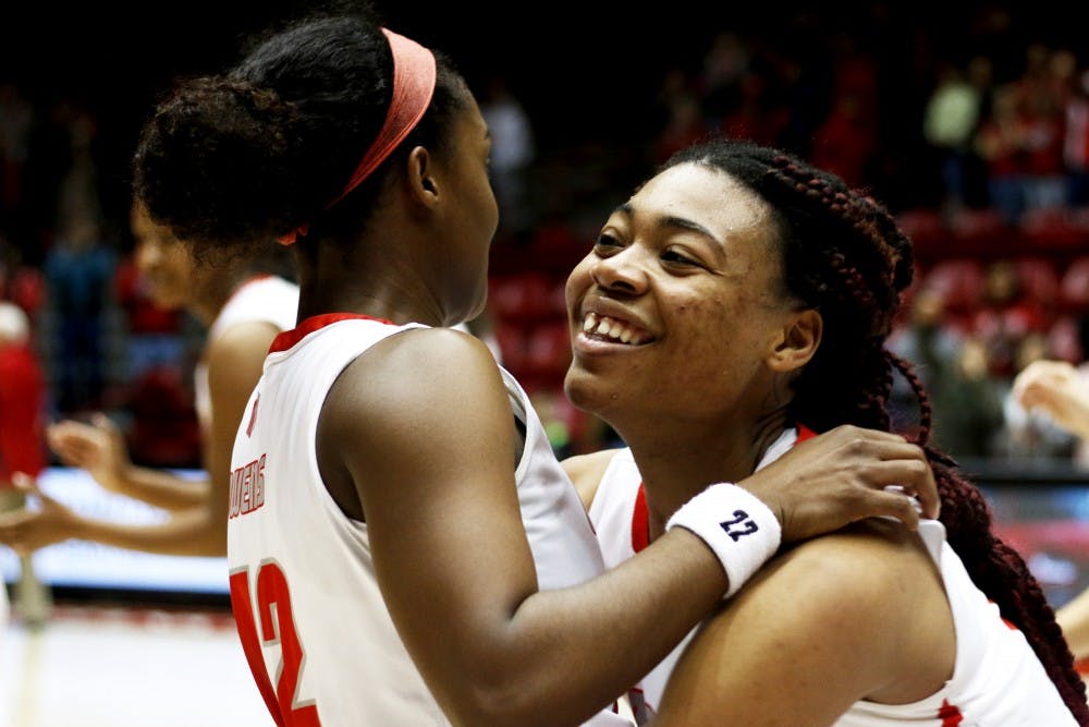 Senior forward Khadijah Shumpert (right) embraces&nbsp;senior guard Bryce Owens at the end of New Mexico's&nbsp;game against Utah State February, 2016. The Lobos played San Jose State in the Mountain West Tournament Tuesday night and beat them 65-51. Their next game in the tournament will be against Colorado State on Wednesday at 7:30 p.m. in Las Vegas, Nevada.&nbsp;