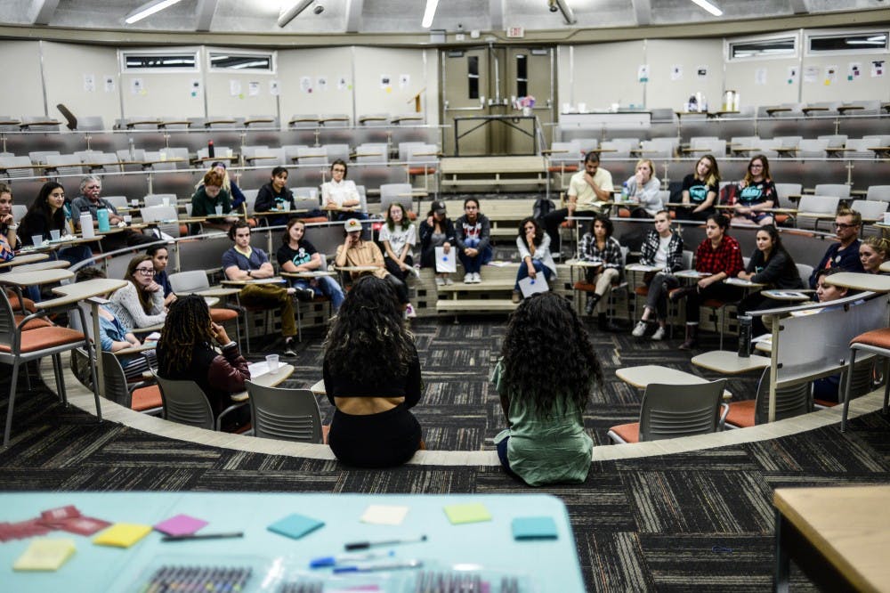 With tacos in hand, members of Young Women United lead a group discussion about reproductive justice inside the Kiva Auditorium on Oct. 23 2017, as part of UNM?s annual Sex Week. 