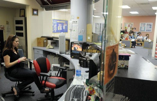 Katie Vadnais,  along with others students, watches the second presidential debate at the Student Resident Center commons Tuesday.