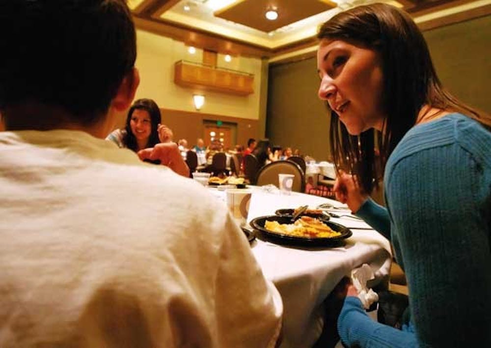 ASUNM President Ashley Fate talks to Lew Wallace Elementary School students during a Thanksgiving lunch Monday in the SUB. 