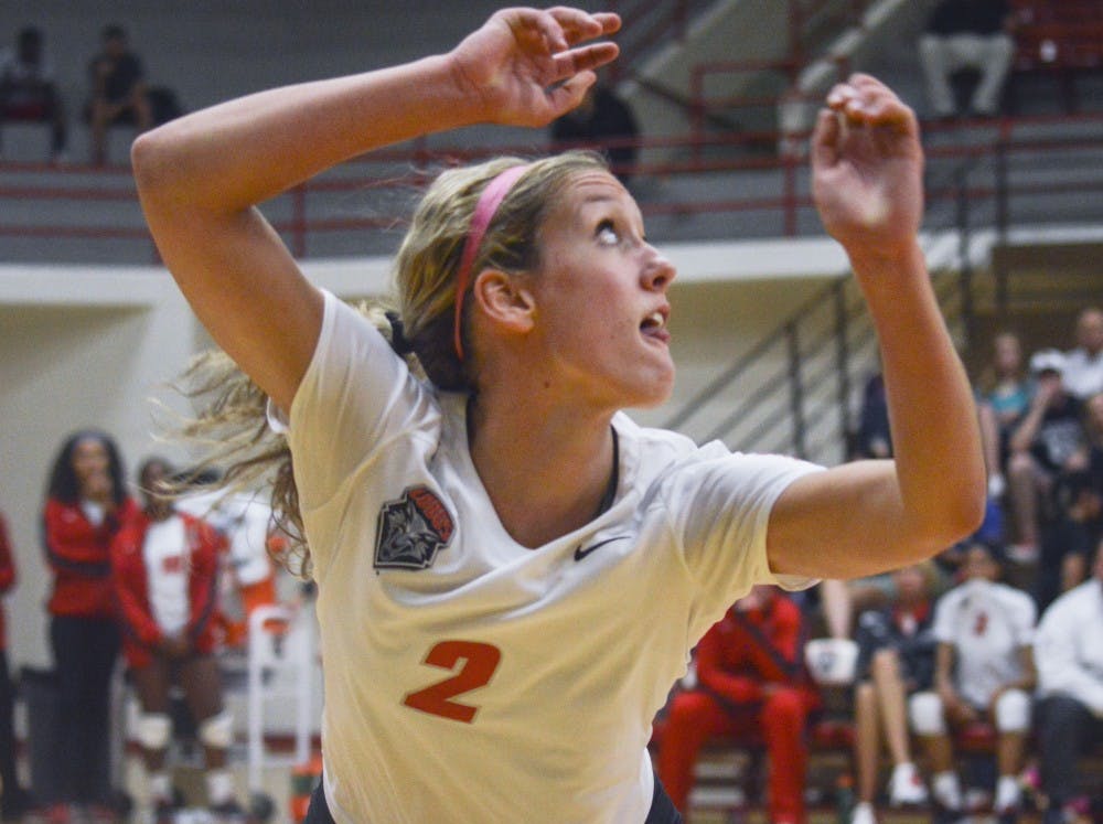 Lobo redshirt junior setter Hannah Johnson watches the ball go over the net during the volleyball game against Utah State at Johnson Center on Thursday night. The game went into overtime, where the Lobos defeated Utah State 3-2.