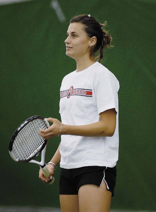 UNM tennis player Iva Gersic takes a break between sets during Tuesday's practice at the UNM Tennis Complex. 