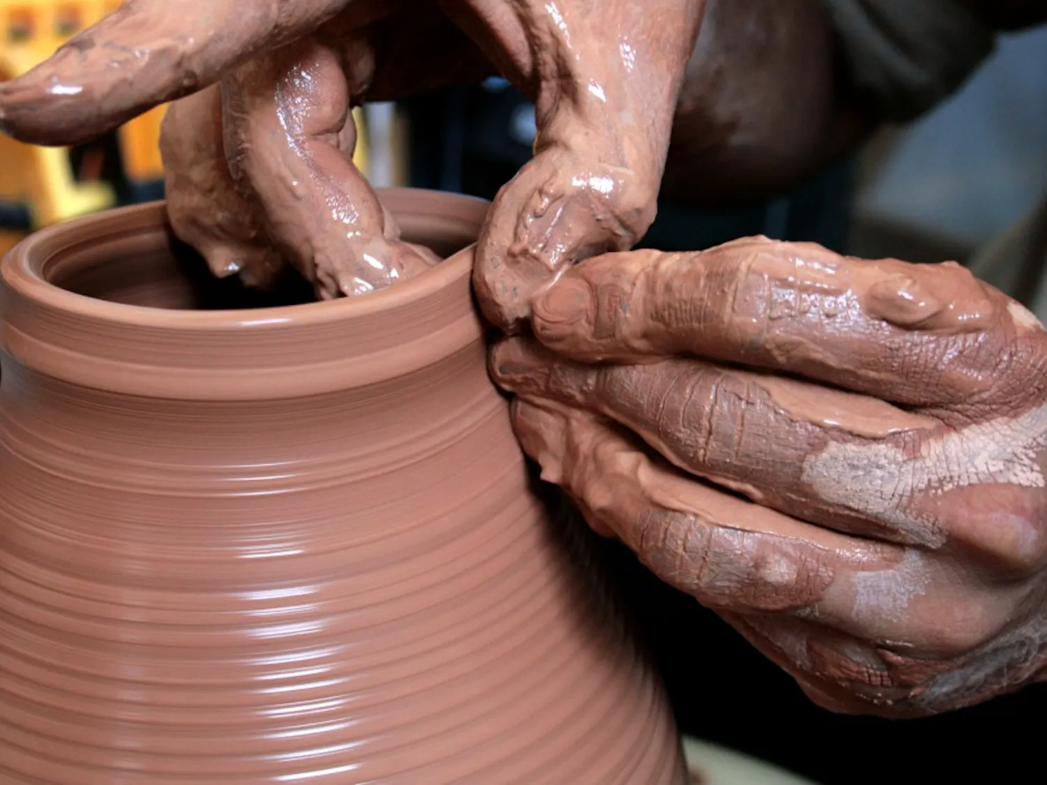 Patrick Trujillo molds a pot in his studio, Not Made in China. Studio space is available for $50 a month.