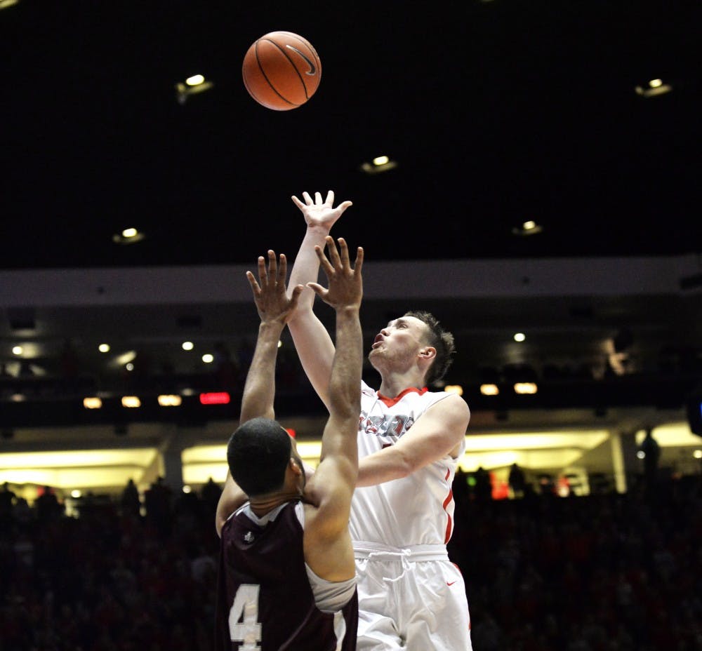 Redshirt sophomore guard Cullen Neal leaps past Texas Southerns Jose Rodriguez at WisePies Arena Friday nights. The Lobos beat out the Tigers 86-57 and play NMSU this Sunday in Las Cruces, NM.&nbsp;