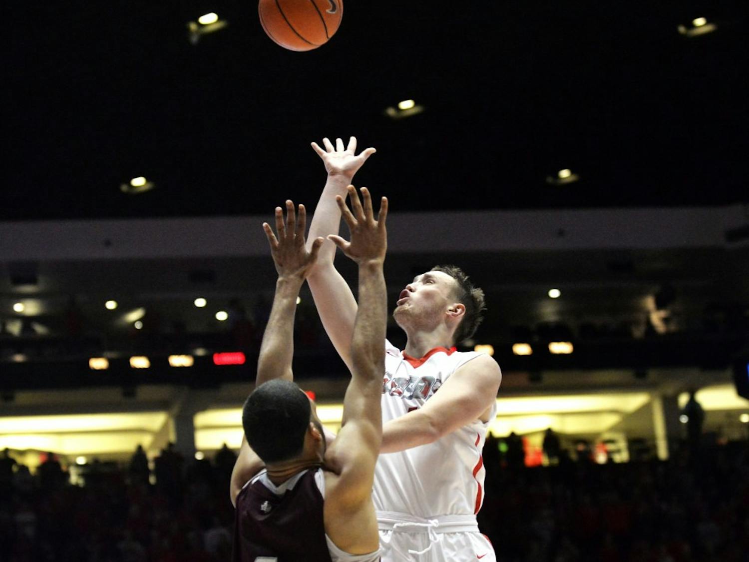 Redshirt sophomore guard Cullen Neal leaps past Texas Southerns Jose Rodriguez at WisePies Arena Friday nights. The Lobos beat out the Tigers 86-57 and play NMSU this Sunday in Las Cruces, NM.&nbsp;