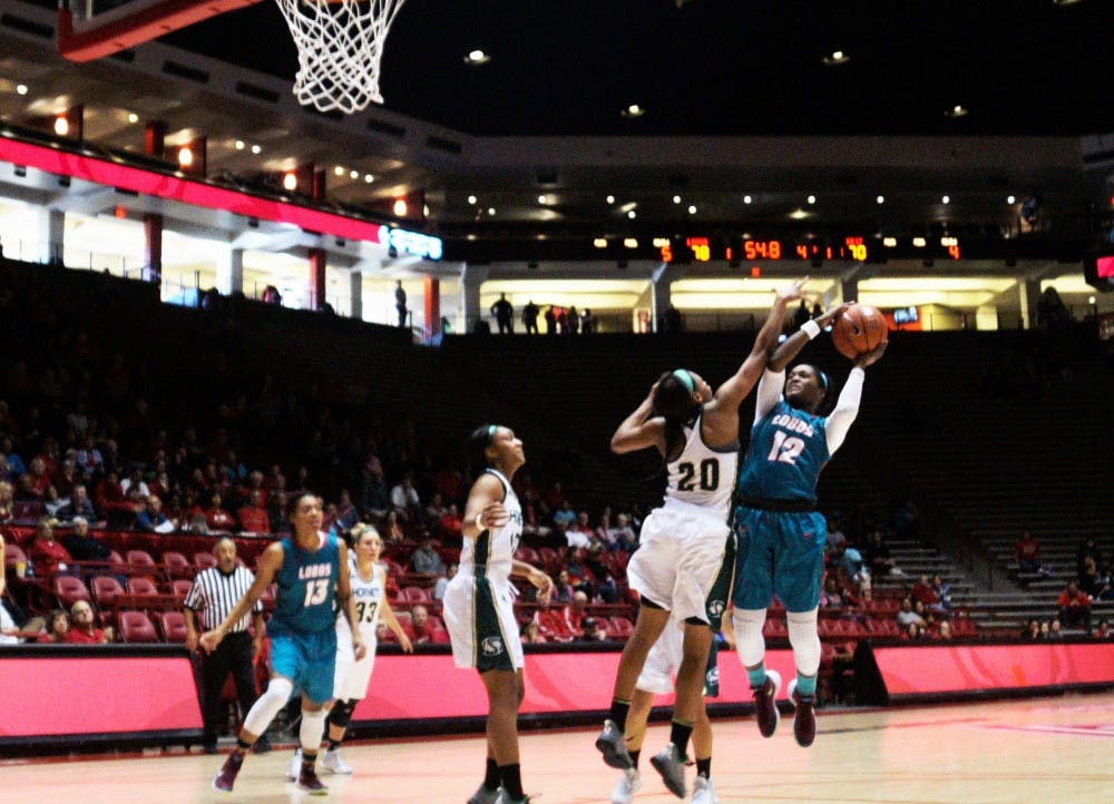 Guard Bryce Owens (12) tries to score against Sacramento State at WisePies Arena on Saturday afternoon. The Lobos collected a 84-71 win against the Hornets.