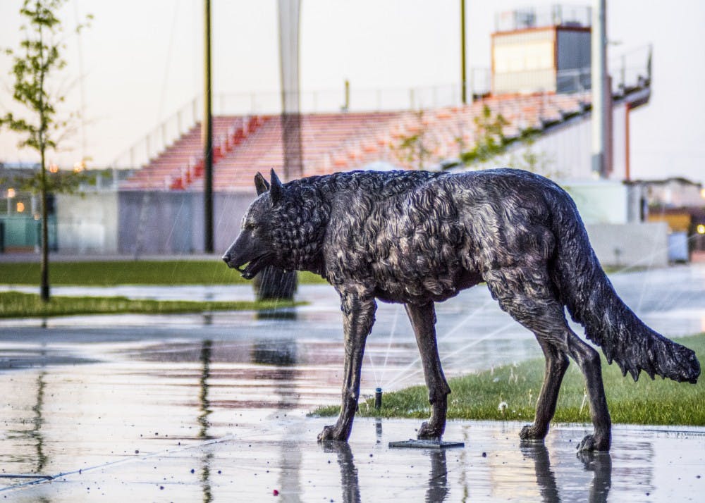 Sprinklers water the grounds at the Lobo Softball Fields Thursday morning.