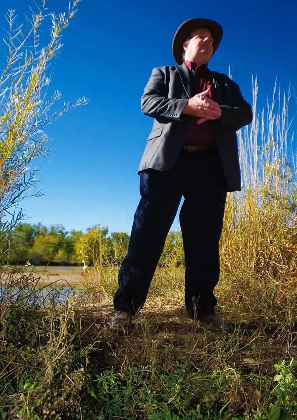 NMSU professor Brian Hurd answers reporters' questions during an interview on the bank of the Rio Grande near Tingley Beach.