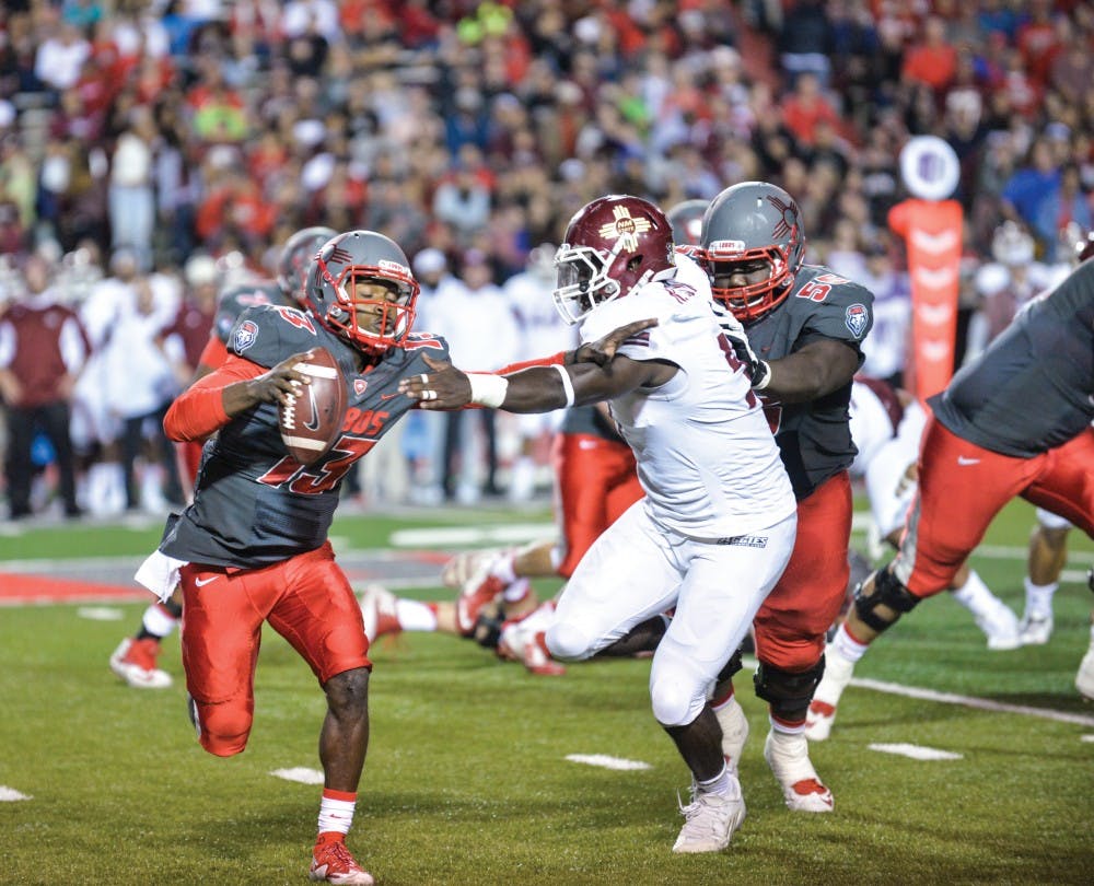 Quarterback Lamar Jordan pushed back a NMSU defensman Oct. 3 at University Stadium. The Lobos lost to Nevada 17-35 this past Saturday and play the University of Hawaii Oct. 17. 
