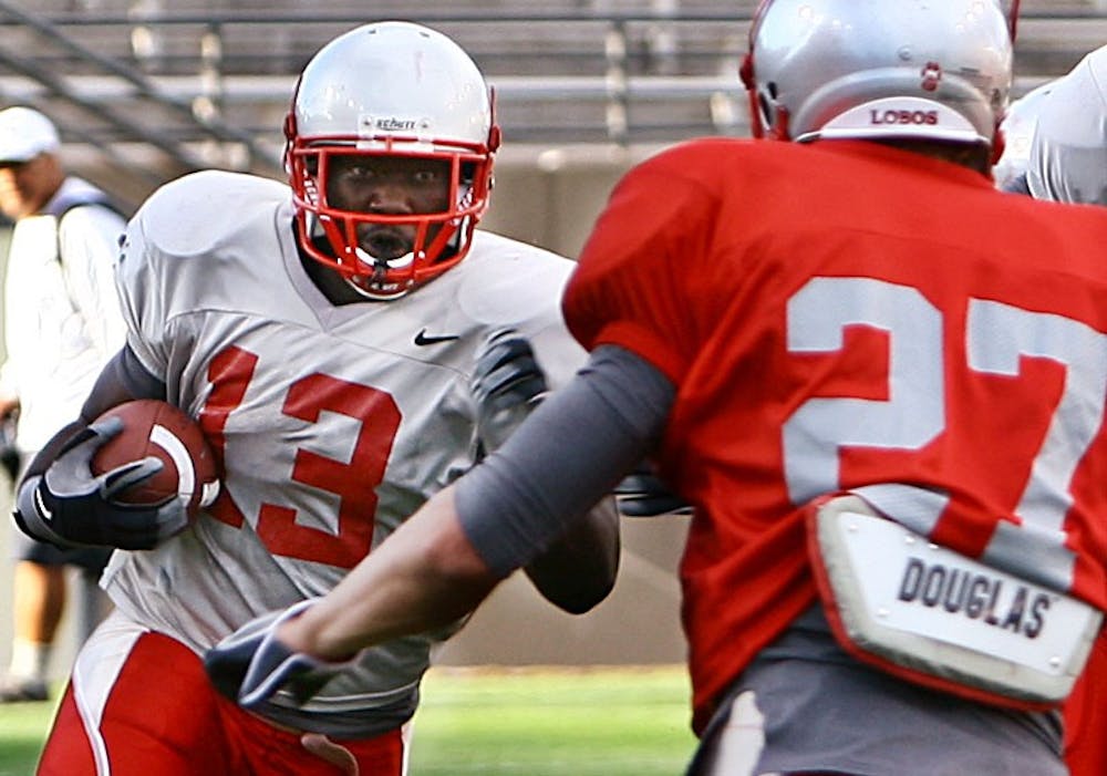 	Running back James Wright looks to initiate contact with safety Jesse Paulsen in this in fall 2009 scrimmage photo. Wright said he wants to have a bigger role in the back eld this year.