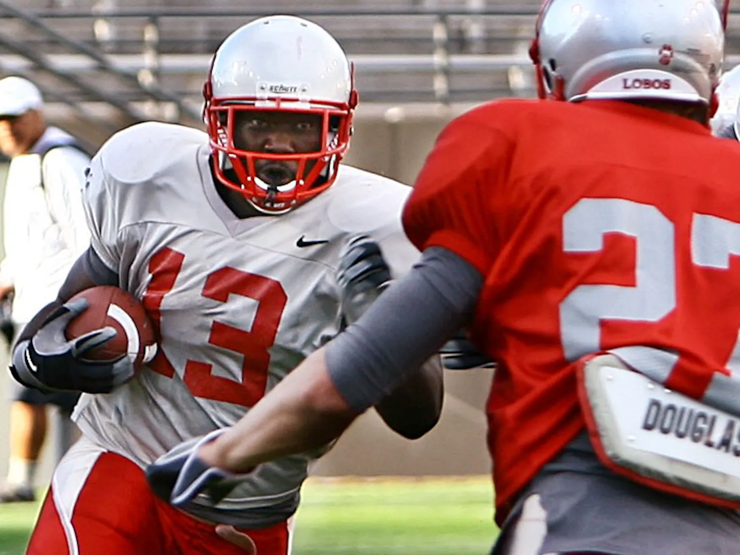 Running back James Wright looks to initiate contact with safety Jesse Paulsen in this in fall 2009 scrimmage photo. Wright said he wants to have a bigger role in the back eld this year.