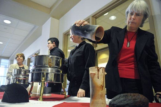 Professor Patricia Crown prepares a chocolate drink from an ancient Mayan recipe in the SUB on Tuesday. The Kakawa Chocolate House's chile chocolate elixir was one of several creations presented at Tuesday's tasting.