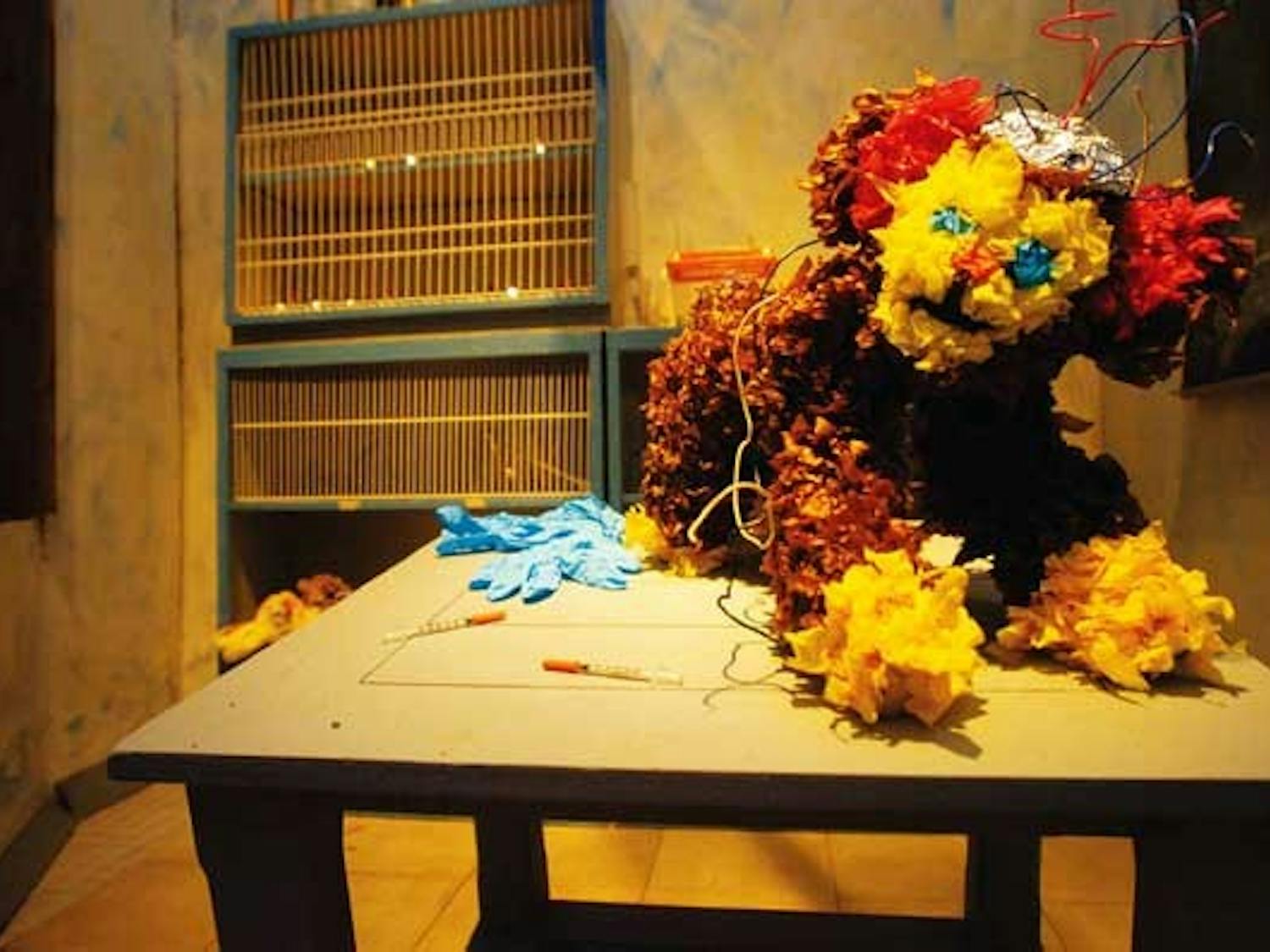 A monkey is operated on in the animal-testing portion of "Quienes Son Los Animales: Altars to Lives Sacrificed for Human Greed" at Working Classroom's Visiones Gallery at 212 Gold Ave. S.W.