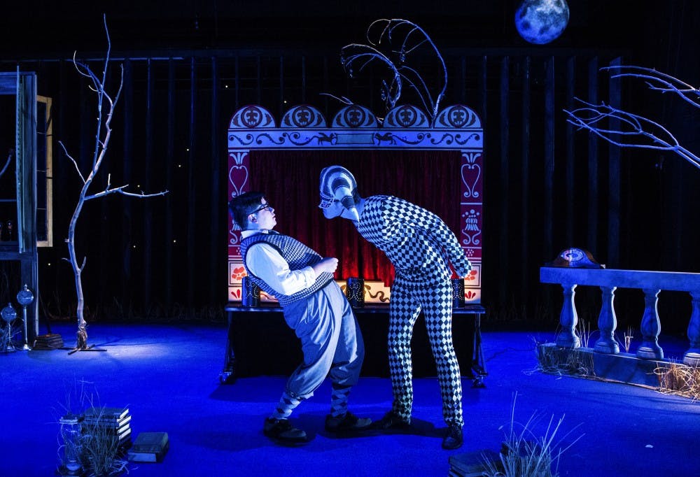 Andres Moreno’s character (left) encounters the harlequin played by Michael McMahan (right) in the production of ”As Five Years Pass.” The play was written by Federico García Lorca.