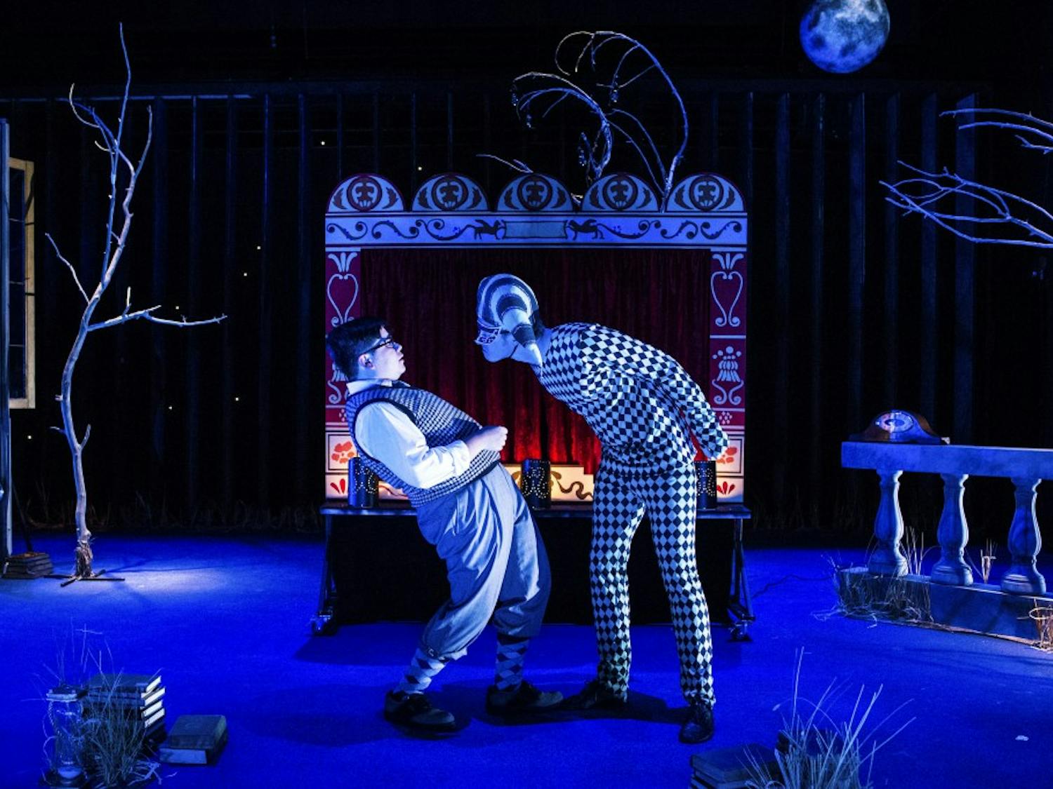 Andres Moreno’s character (left) encounters the harlequin played by Michael McMahan (right) in the production of ”As Five Years Pass.” The play was written by Federico García Lorca.