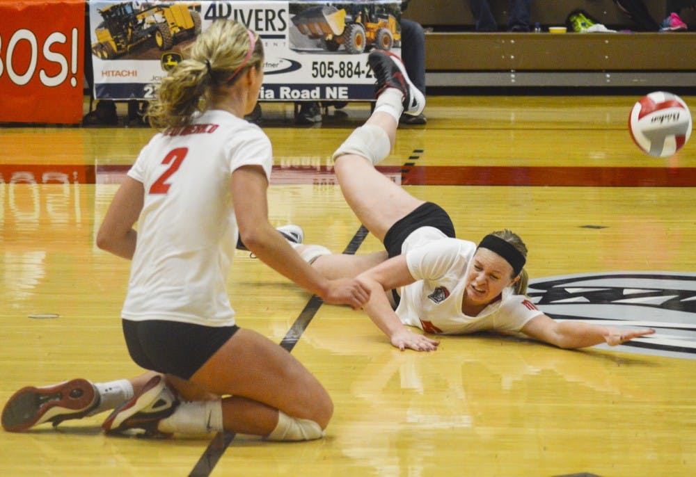 Lobo outside hitter Julia Warren falls after attempting to keep the ball in play during Thursday night’s volleyball game against Utah State at Johnson Gym. The Lobos played against Boise State on Saturday afternoon and won 3-0.