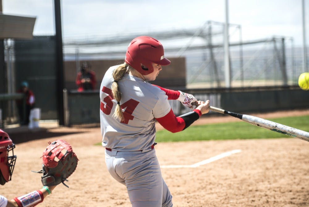 Sophomore catcher Chelsea Johnson bats against a Fresno State pitcher on Sunday at the Lobo Softball Field. The Lobos will play Colorado State this weekend.