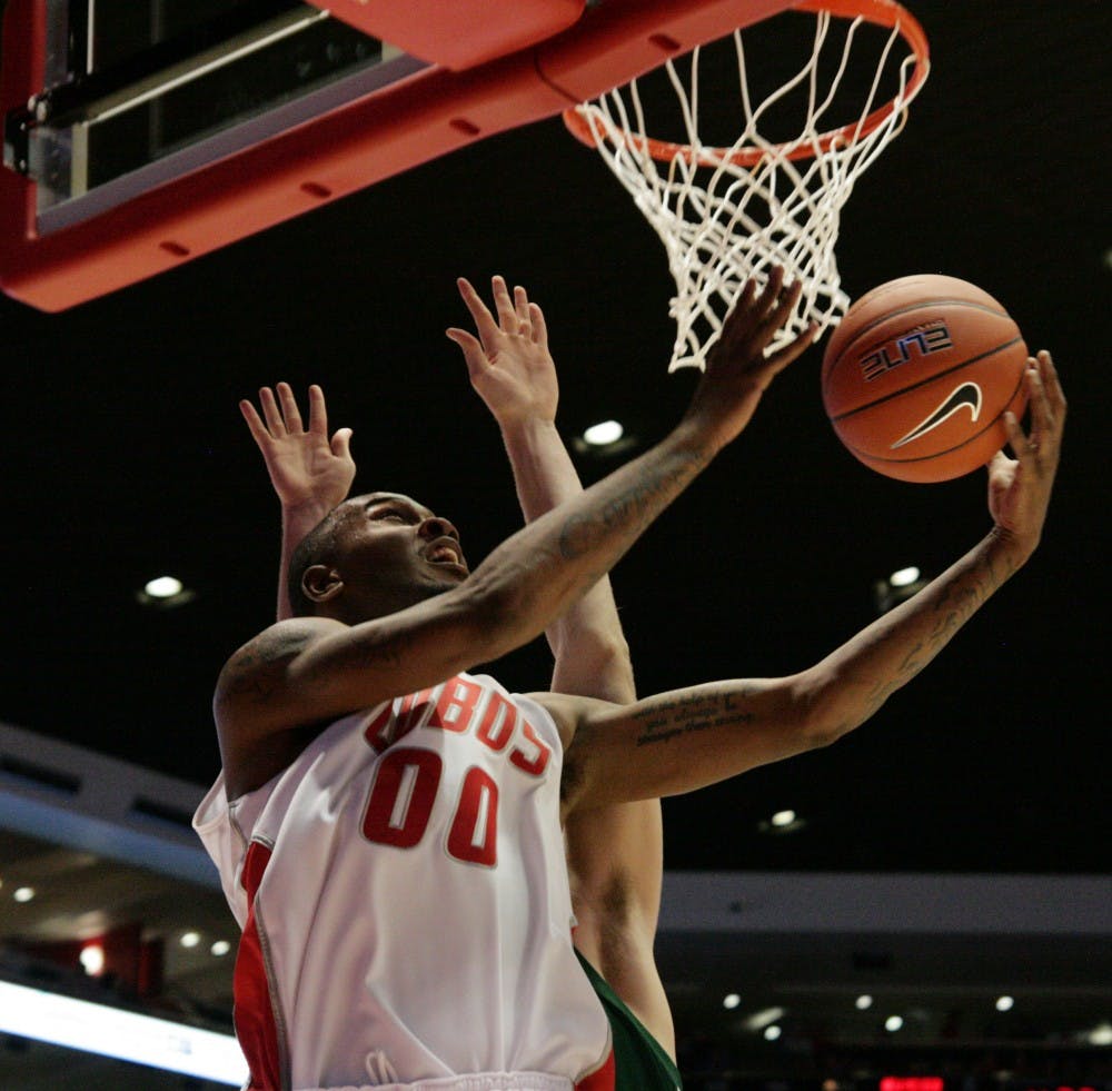	UNM forward A.J. Hardeman shields his defender on the way to the basket Tuesday at The Pit. The Lobos defeated Eastern New Mexico 80-58 in their first exhibition game.