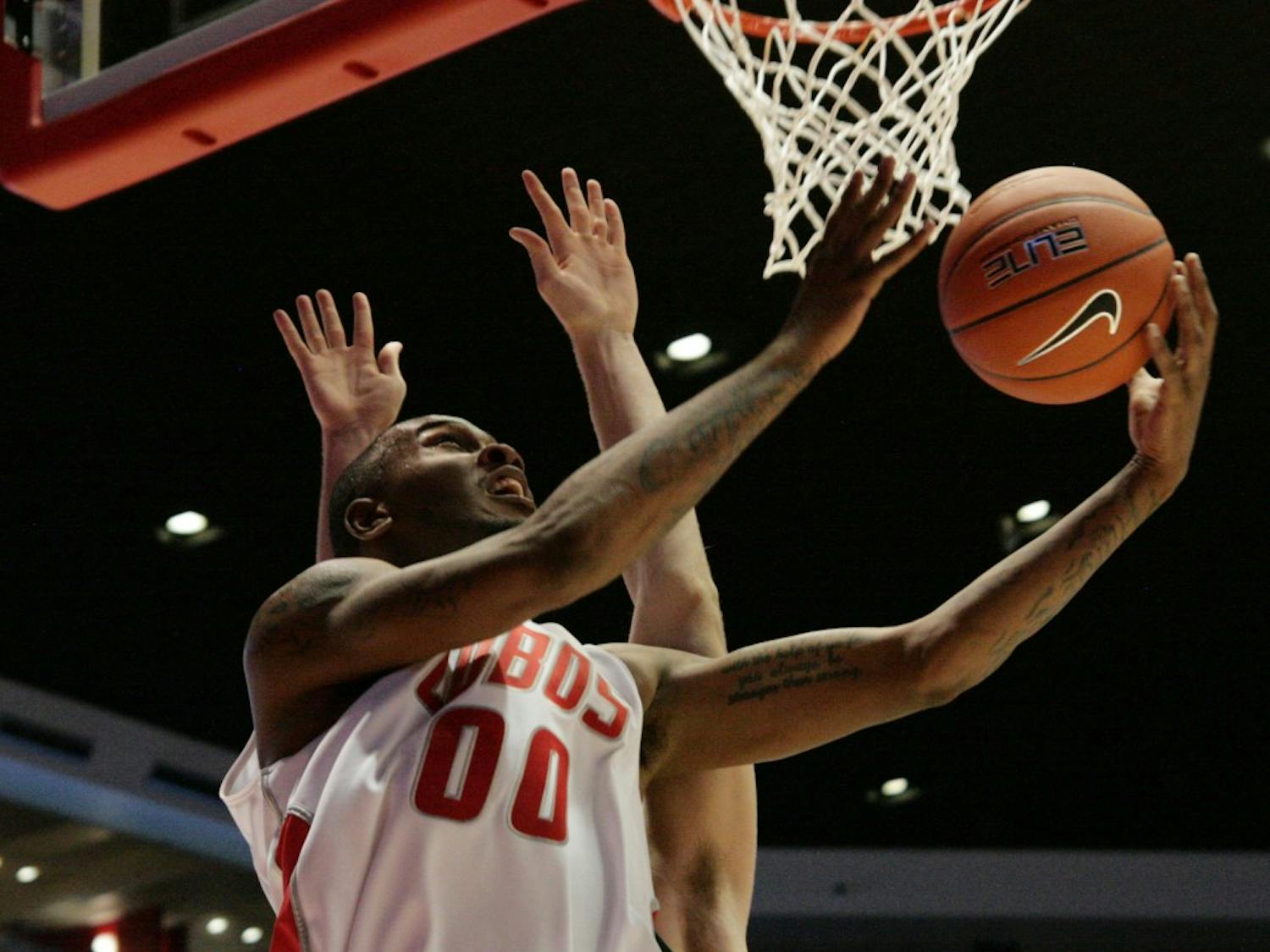 	UNM forward A.J. Hardeman shields his defender on the way to the basket Tuesday at The Pit. The Lobos defeated Eastern New Mexico 80-58 in their first exhibition game.