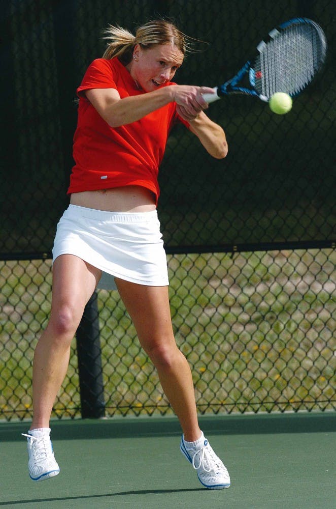 Sandra Zmak hits a two-handed forehand against San Diego State's Holly Bagshaw during the Mountain West Conference Tournament in Colorado Springs, Colo., on Thursday. The Lobos beat the Aztecs 4-0.