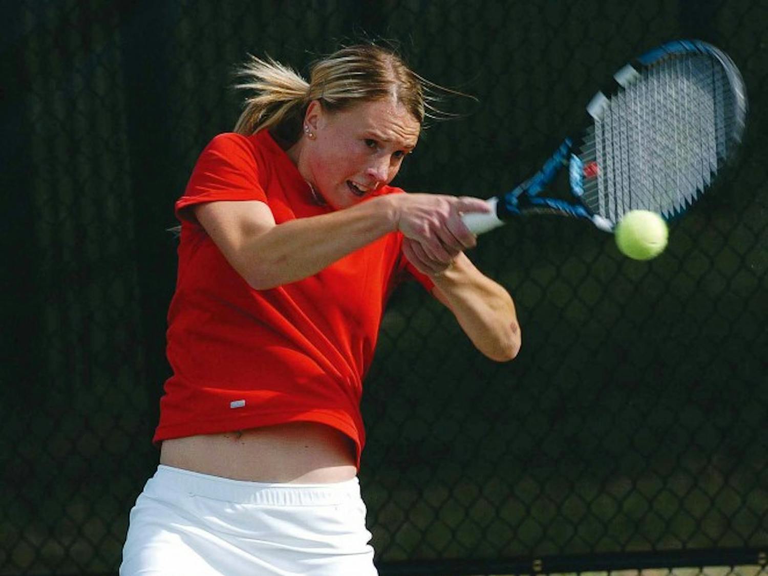 Sandra Zmak hits a two-handed forehand against San Diego State's Holly Bagshaw during the Mountain West Conference Tournament in Colorado Springs, Colo., on Thursday. The Lobos beat the Aztecs 4-0.