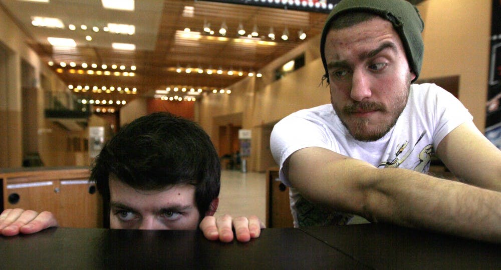 	Students Alexander Payne, left, and Logan Migliore keep watch from their fortress on Monday in Popejoy. Both are student filmmakers in their third year at UNM. They film many of their movies on campus.