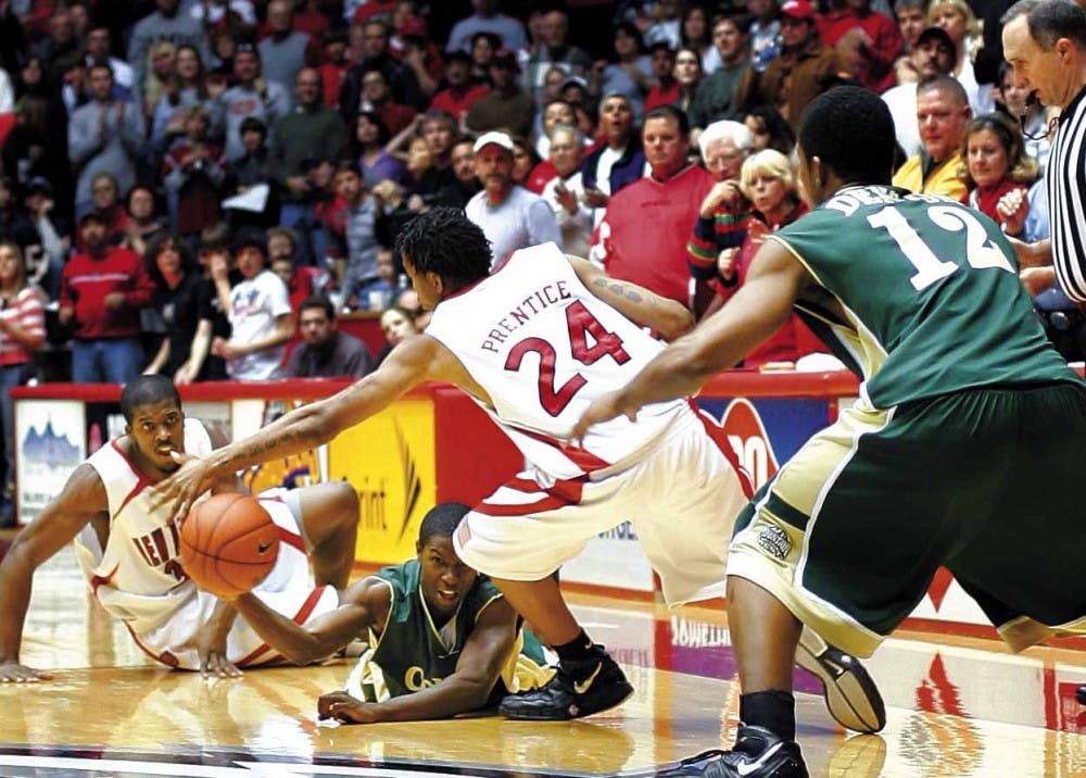 Colorado State guard Cory Lewis passes the ball to teammate Tim Denson after recovering it from UNM forward Tony Danridge on Saturday at The Pit. The Lobos lost 88-79.