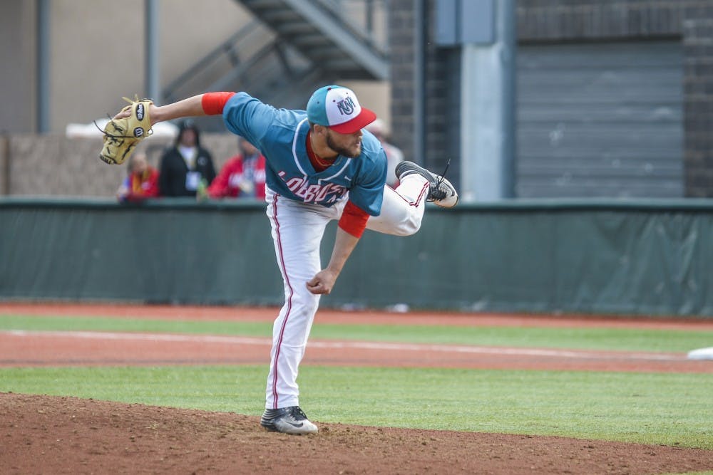 Senior Luis Gonzalez follows through with a pitch against Fresno State Sunday, April 2, 2017 at Santa Ana Star Field. The Lobos tied San Jose State 5-5 in their third game.&nbsp;