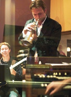 Albuquerque native Justin Ray, center, performs at Scalo Northern Italian Grill on Monday during the release party of his self-titled debut album. Ray, along with guitarist Randy Napoleon, left, are part of swing singer Michael Bubl