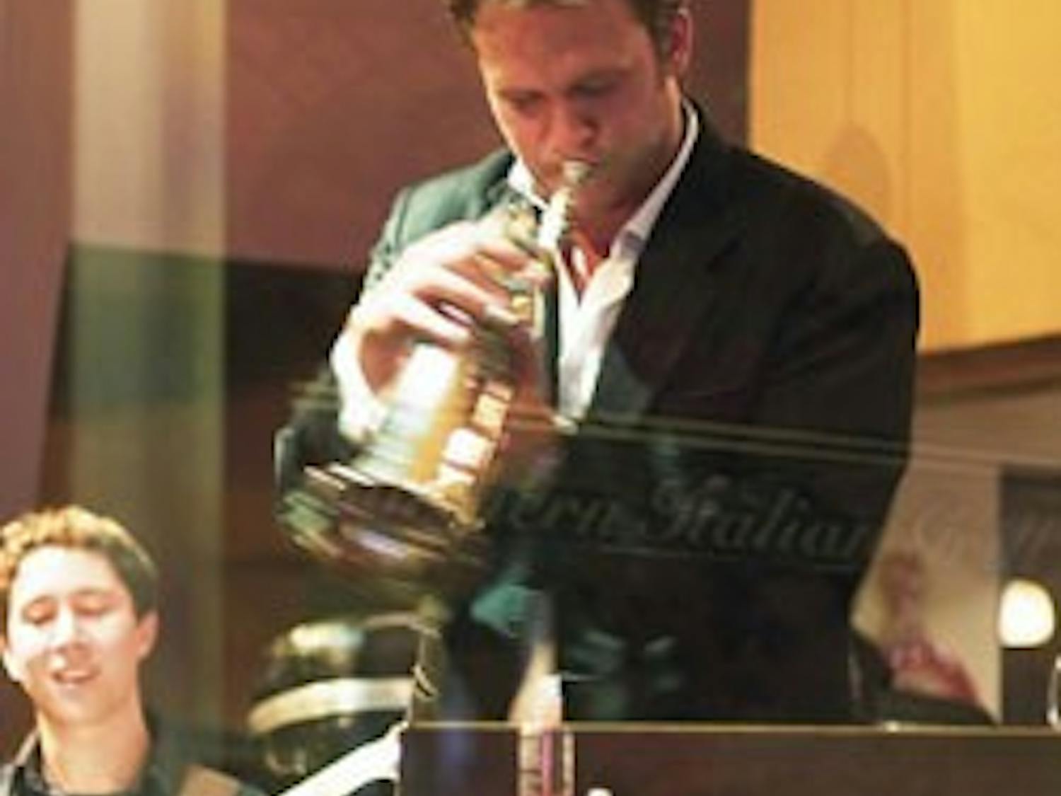 Albuquerque native Justin Ray, center, performs at Scalo Northern Italian Grill on Monday during the release party of his self-titled debut album. Ray, along with guitarist Randy Napoleon, left, are part of swing singer Michael Bubl