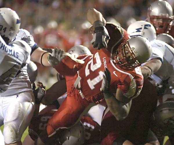 With a rushing total of 146 yards for the night, Rodney Ferguson scores a three-yard touchdown to give the Lobos a 28-24 lead in the third quarter after an Air Force turnover.  