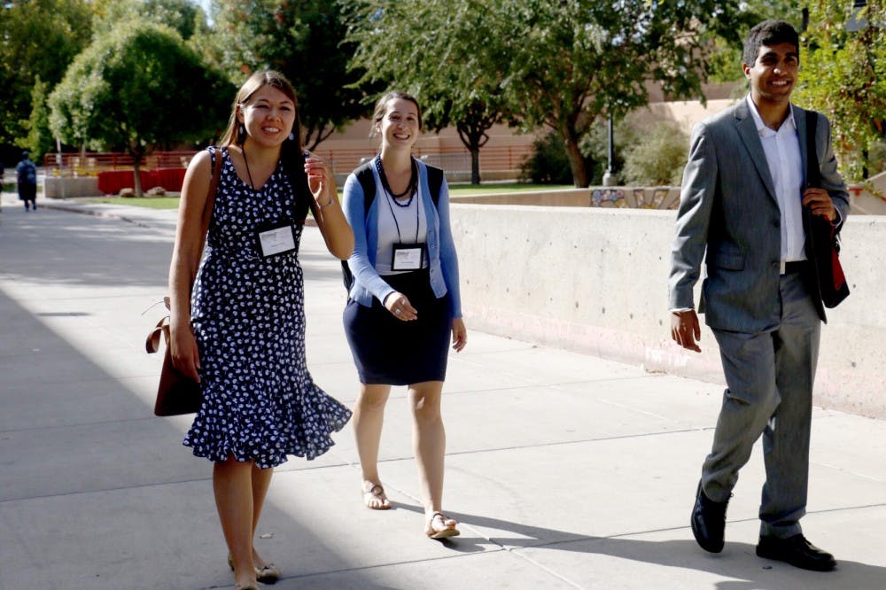 Tanveer Kalo, right, and Halley Choy, left, walk with McNair advisor Aloe Sarhanis on&nbsp;Friday, Sept. 30, 2016 at UNM Main Campus.&nbsp;