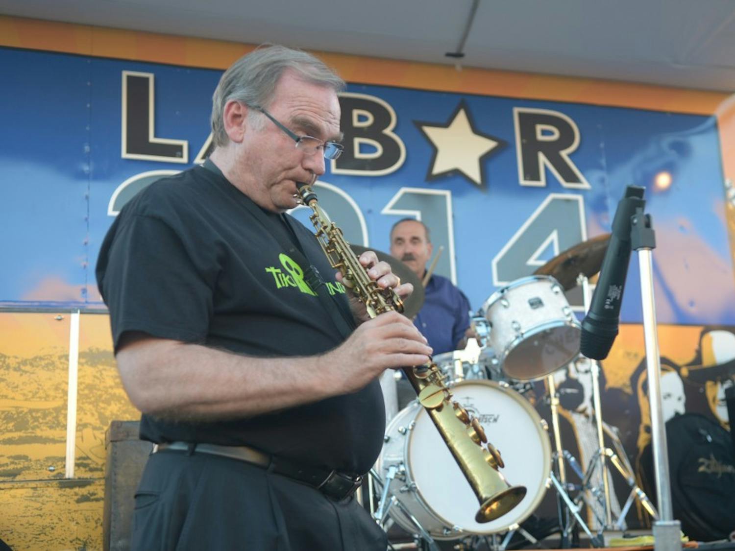 New Mexico Attorney General Gary King plays a saxophone during a Labor Day Event at Tractor Brewing in Downtown Albuquerque on Sept. 1, 2014. King, a Democrat, is running against incumbent Gov. Susana Martinez in the upcoming election.