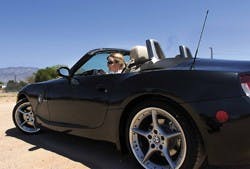 Ali Patterson strains to see over the dashboard of the BMW Z4 during a test drive Monday.