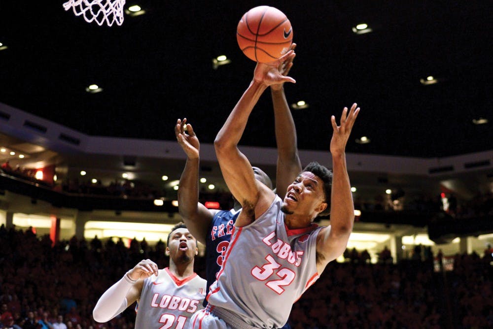 Redshirt junior forward Tim Williams attempts to rebound a ball away from a Fresno State player Saturday night at WisePies Arena. Williams rebounded six balls and scored 18 points against the Bulldogs. The Lobos ended up losing 92-82.