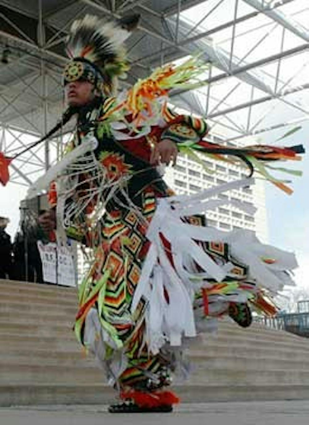 Dwayne Crue dances at Civic Plaza on Friday to commemorate the 30th anniversary of the Longest Walk, a five-month journey from San Francisco to Washington, D.C., in support of American Indian rights.