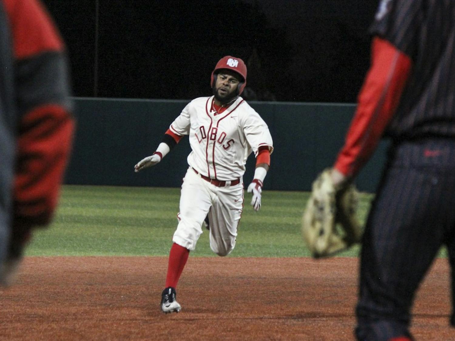 Junior Andre Vigil sprints from second to third at Santa Ana Star Field. The Lobos dropped the opening game 11-6 on Friday night in Nevada.